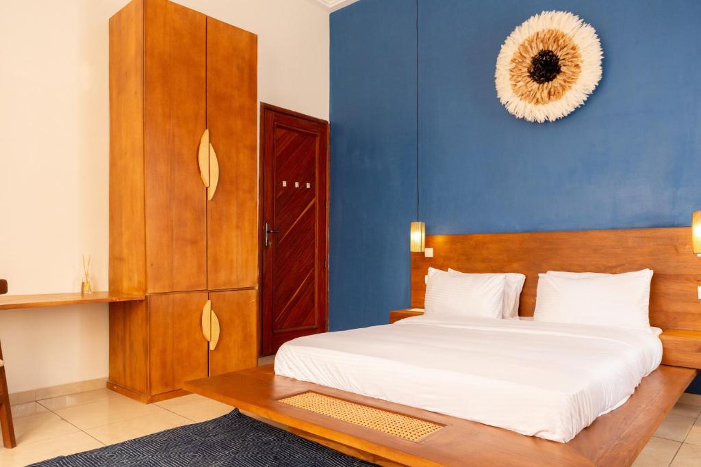 Postel nebo postele na pokoji v ubytování Tamarin Hôtel Cotonou