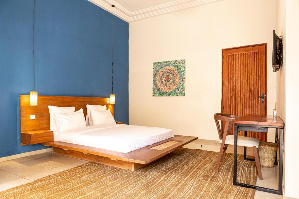 Postel nebo postele na pokoji v ubytování Tamarin Hôtel Cotonou