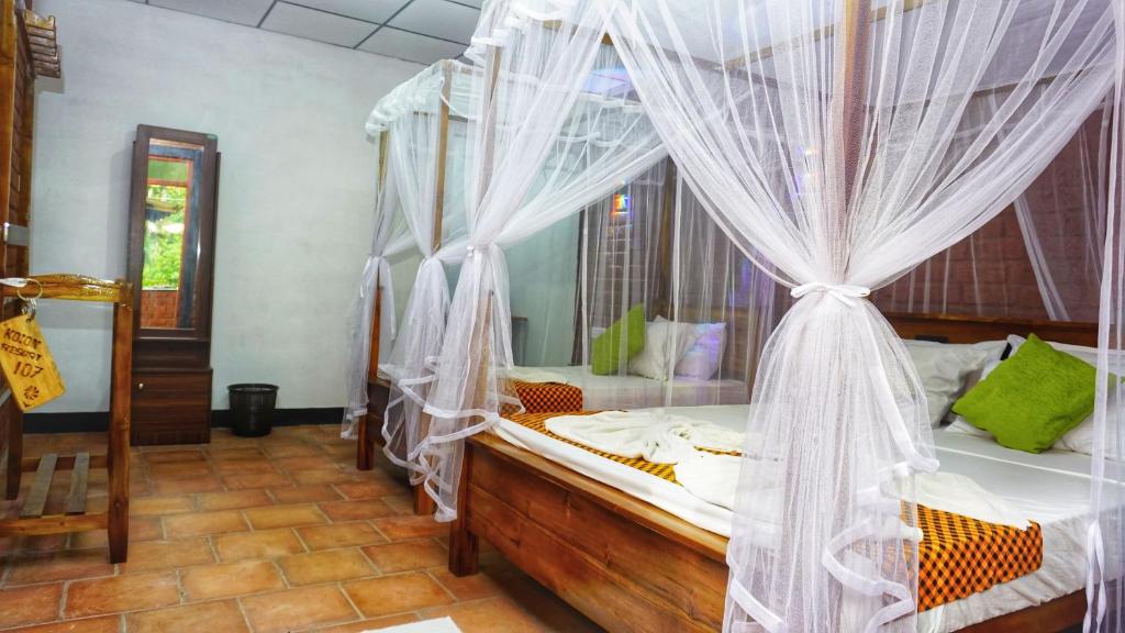 Postel nebo postele na pokoji v ubytování Kolon Resort Sigiriya