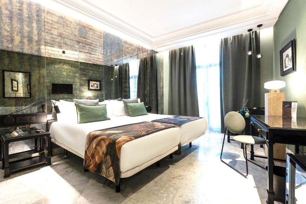 Posteľ alebo postele v izbe v ubytovaní AZZ Mérida Medea Hotel