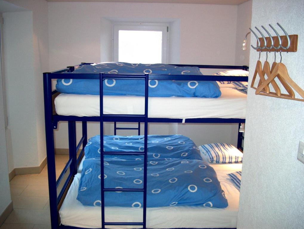 Postel nebo postele na pokoji v ubytování B&B Les Rochers 42 lits