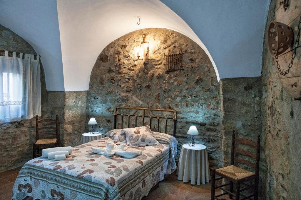 Postel nebo postele na pokoji v ubytování Apartamentos Rurales La Casa de Luis