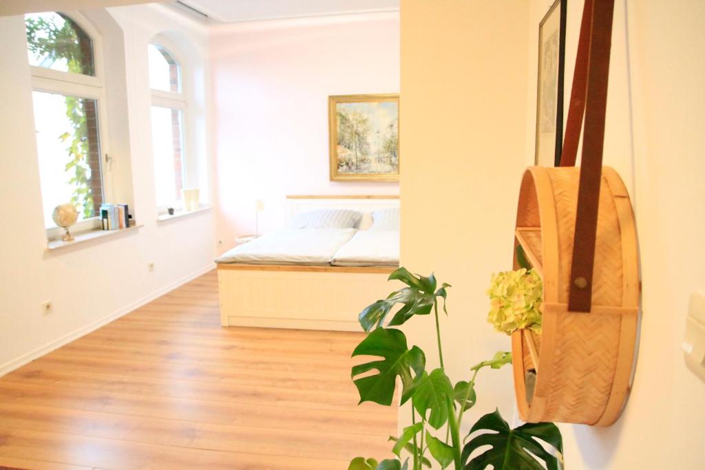 a bedroom with a bed and a plant at Villa Kolck in Xanten