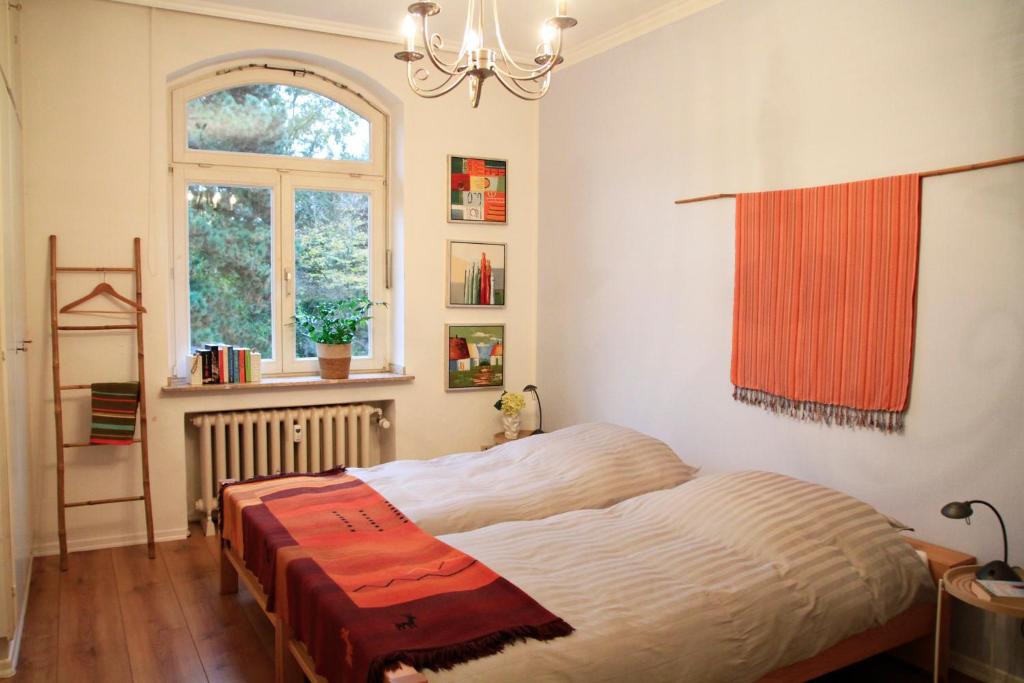 a bedroom with a bed and a window at Villa Kolck in Xanten