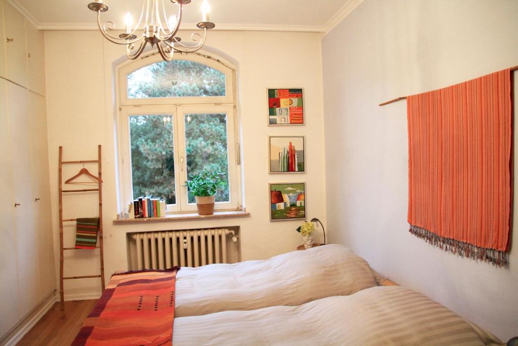 a bedroom with a bed and a window at Villa Kolck in Xanten