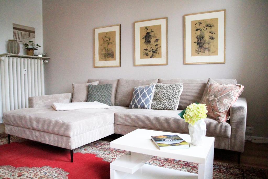 a living room with a couch and a table at Villa Kolck in Xanten