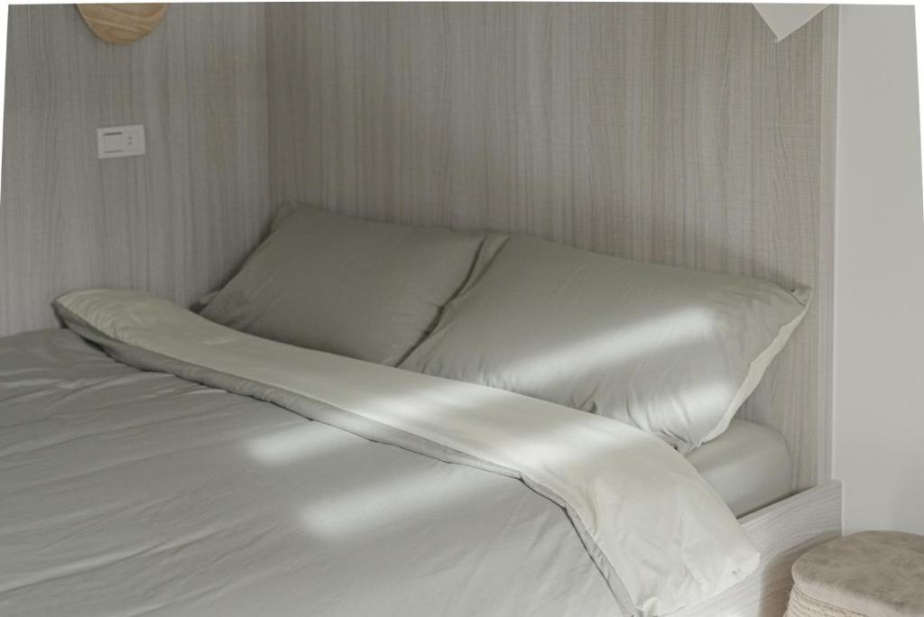 Postel nebo postele na pokoji v ubytování Yukwanhai Hostel