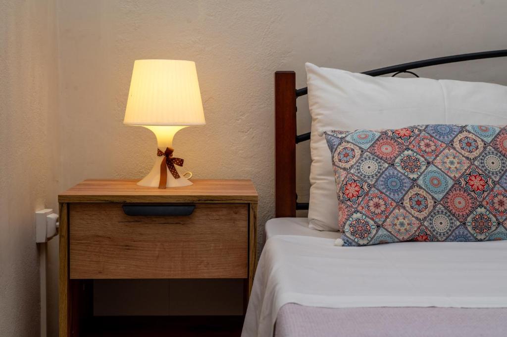 Postel nebo postele na pokoji v ubytování Adonino Apartment