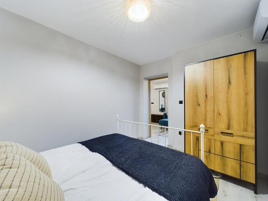 Postel nebo postele na pokoji v ubytování ApartamentySnu, Dom na Przedmieściu