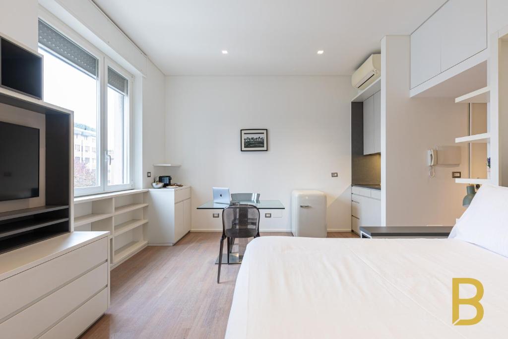 Posteľ alebo postele v izbe v ubytovaní BePlace Garibaldi Suites