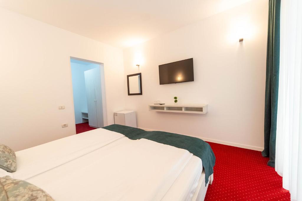 Postel nebo postele na pokoji v ubytování Hotel Cirus