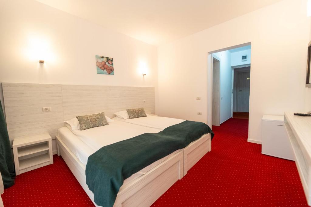 Postel nebo postele na pokoji v ubytování Hotel Cirus