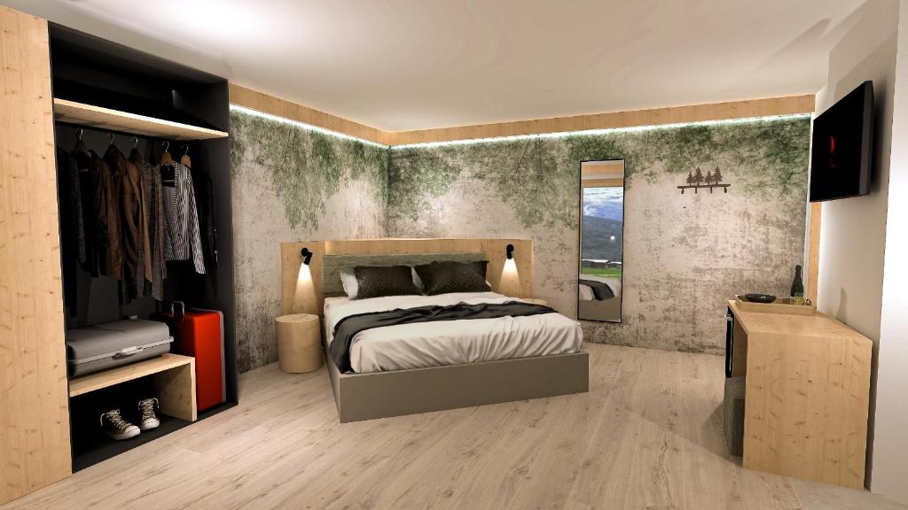 a bedroom with a bed and a mirror in it at Spires Hotel in Canazei