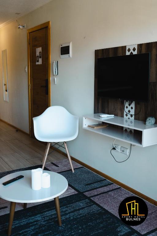 TV a/nebo společenská místnost v ubytování APART HOTEL EN BULNES
