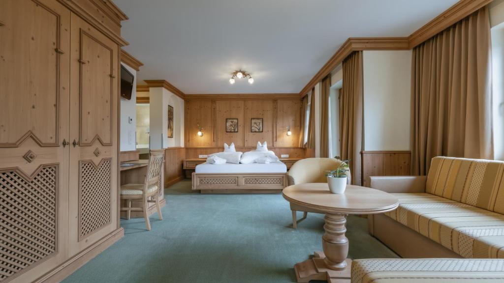 Postel nebo postele na pokoji v ubytování KERSCHDORFER - wohlfühlhotel garni - adults only
