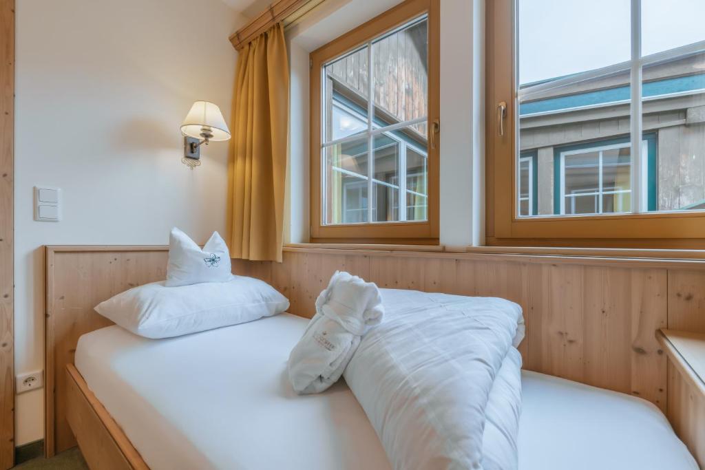 Postel nebo postele na pokoji v ubytování KERSCHDORFER - wohlfühlhotel garni - adults only