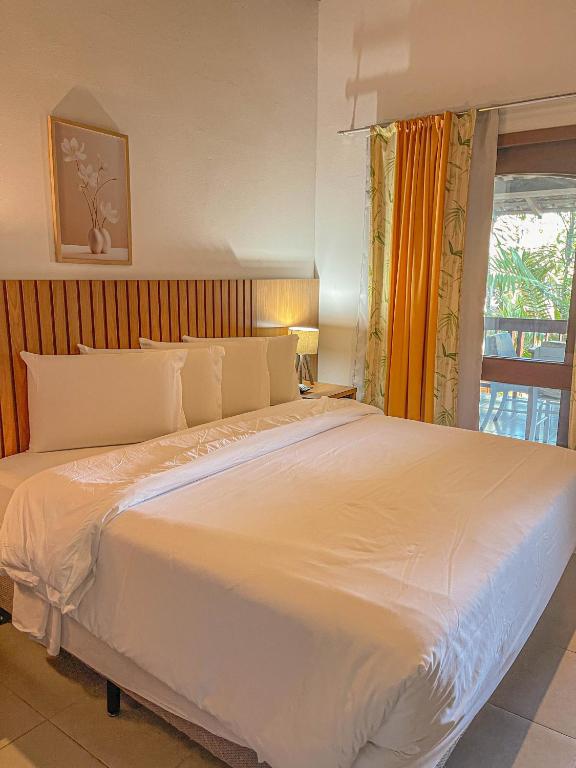 Postel nebo postele na pokoji v ubytování Mar Paraíso Hotel