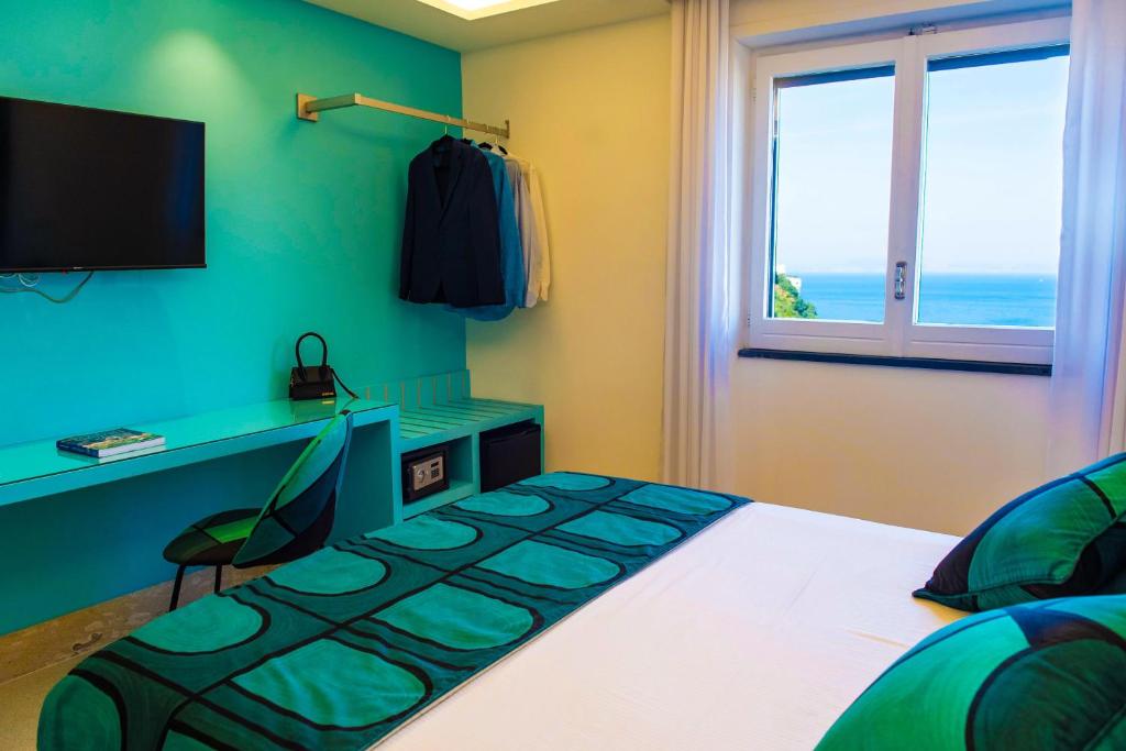 TV a/nebo společenská místnost v ubytování B&B Caporivo
