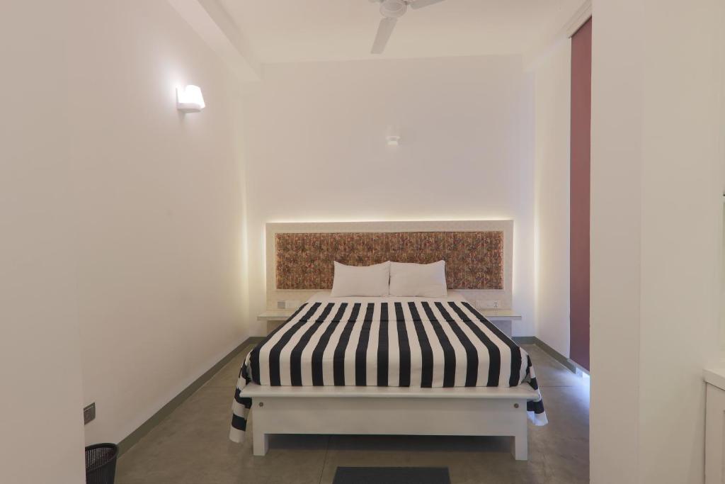 Postel nebo postele na pokoji v ubytování ProEye Apartments - Galle