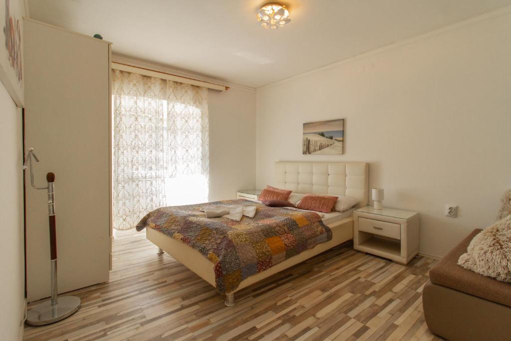 Postel nebo postele na pokoji v ubytování B&B Apartments Coli apartments Afrodita & Antonia