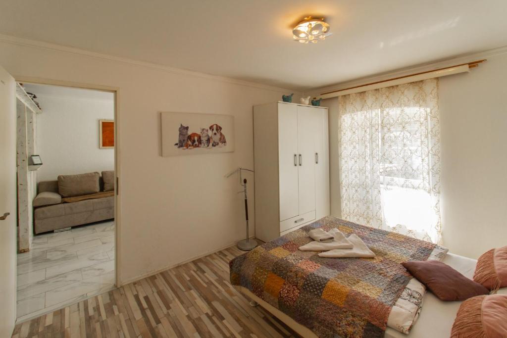 Postel nebo postele na pokoji v ubytování B&B Apartments Coli apartments Afrodita & Antonia