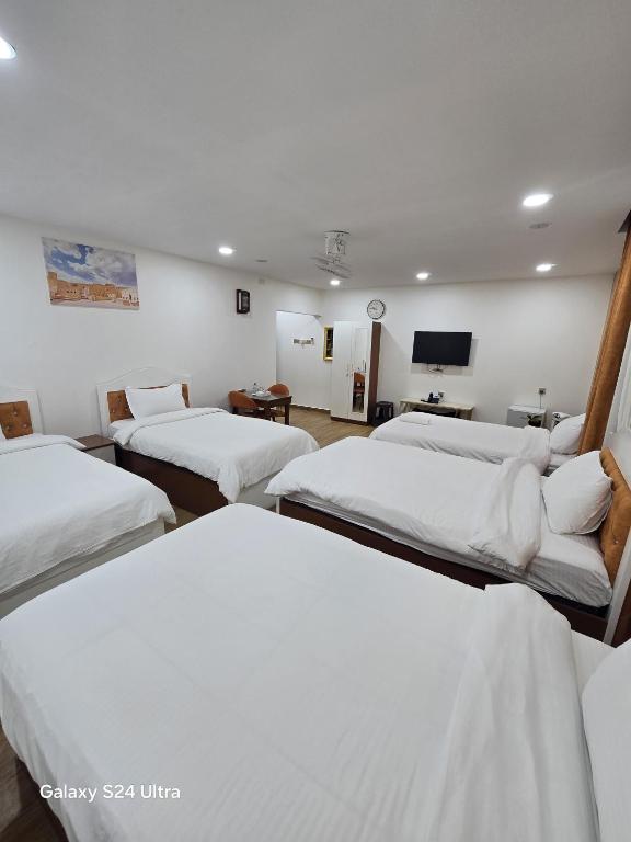 Postel nebo postele na pokoji v ubytování Dar Al Salaam Hospitality House