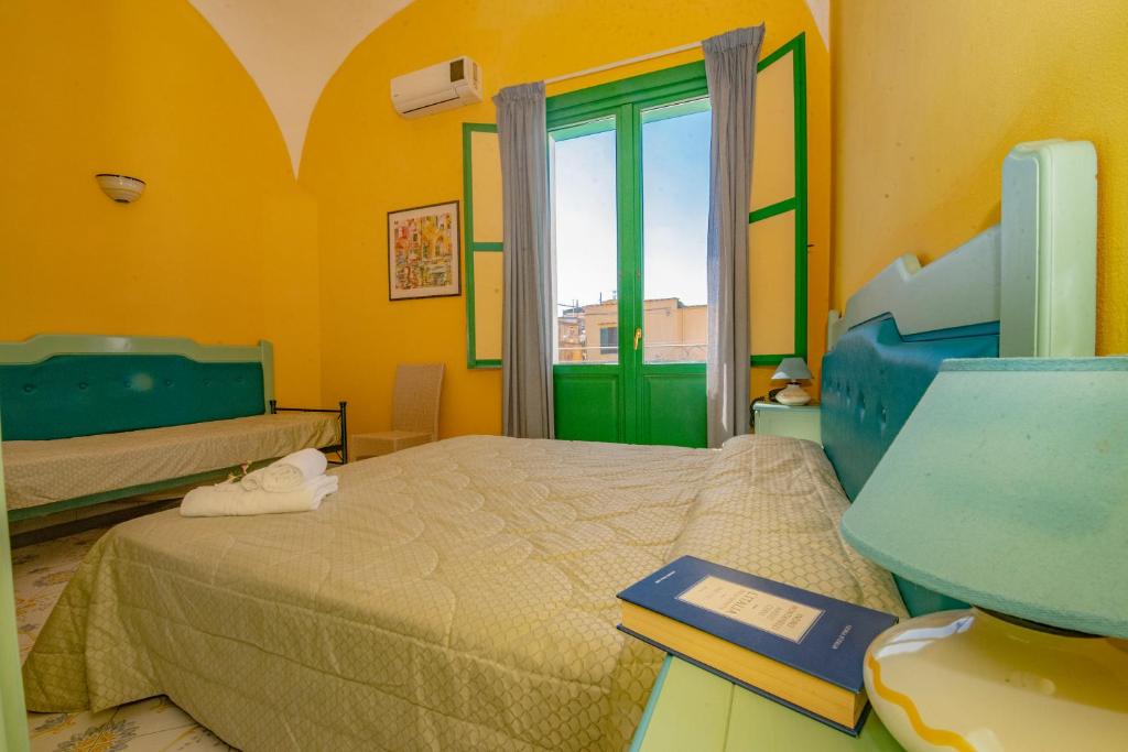 Postel nebo postele na pokoji v ubytování Hotel Savoia