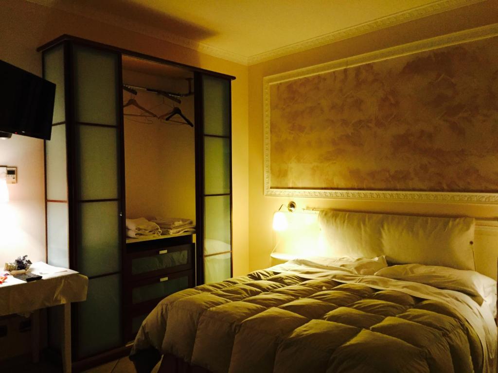 Postel nebo postele na pokoji v ubytování Hotel Martin