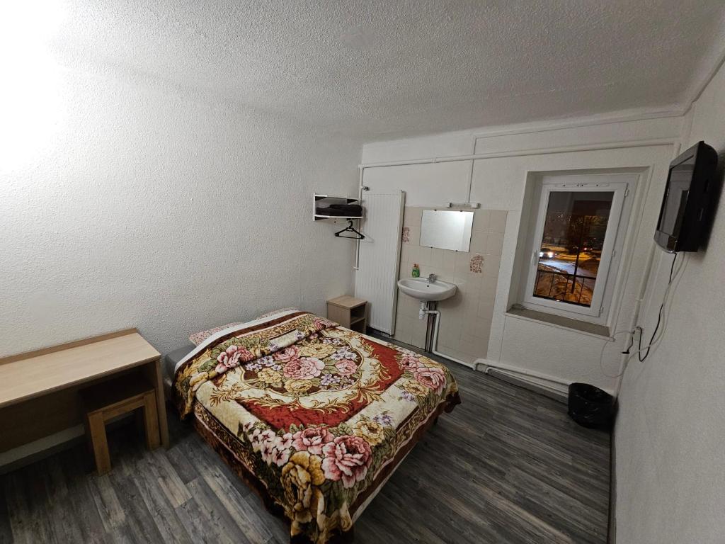 Postel nebo postele na pokoji v ubytování Hotel de la Gare