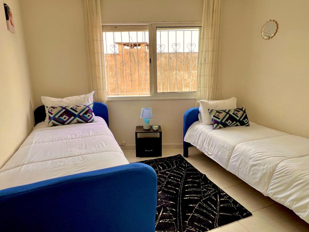 Postel nebo postele na pokoji v ubytování Appartement Central Rabat Tour Hassan