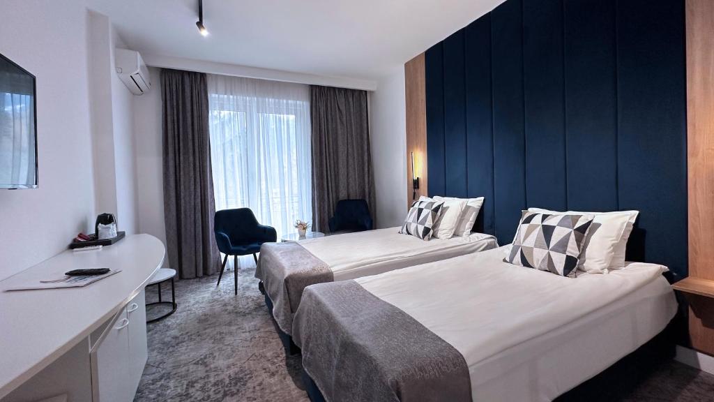 Postel nebo postele na pokoji v ubytování Hotel Soimul