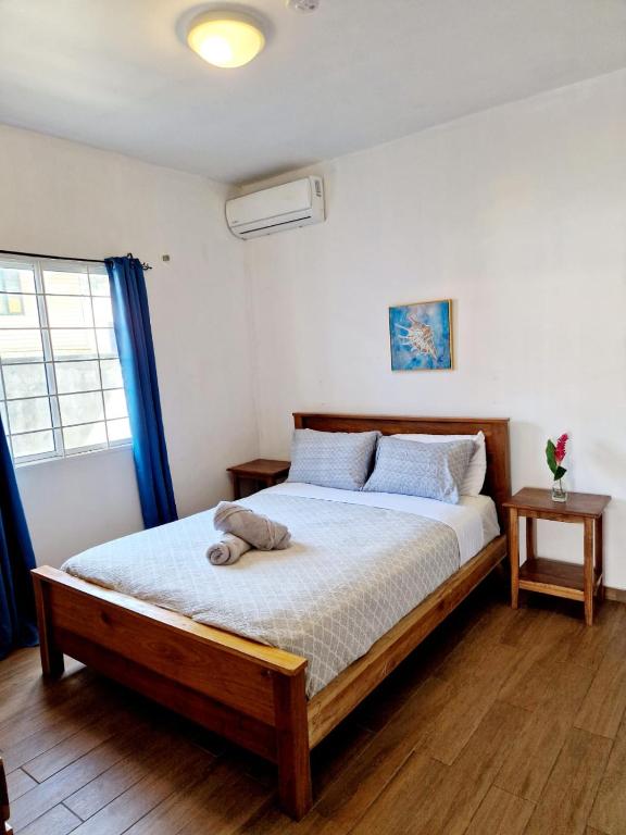 Postel nebo postele na pokoji v ubytování Chango's Apartments