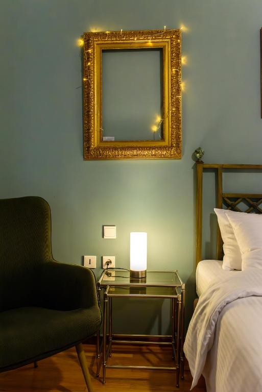 a bedroom with a mirror and a table and a bed at Joanna's city centre apartment in Tripoli