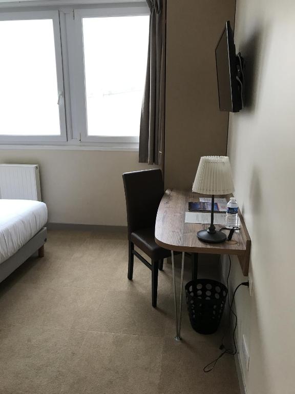 Postel nebo postele na pokoji v ubytování Hotel Les Galets Bleus