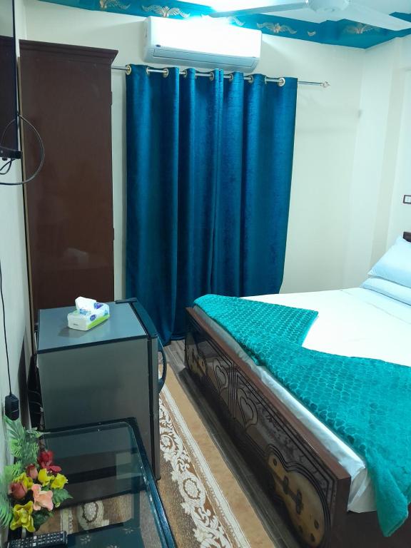 Postel nebo postele na pokoji v ubytování Osiris Guest House