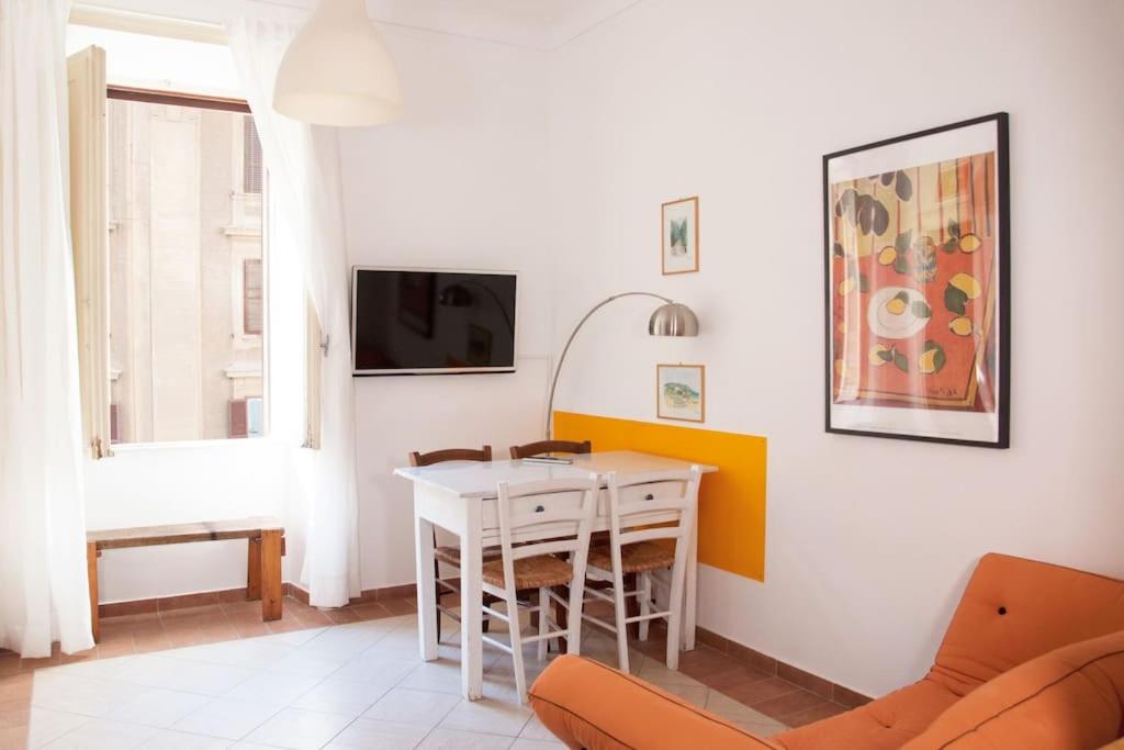a living room with a table and a couch at Shangrila in Rome