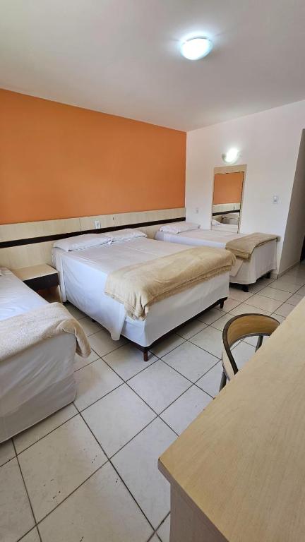Postel nebo postele na pokoji v ubytování JL Temporadas - Quarto Portobello Park Hotel