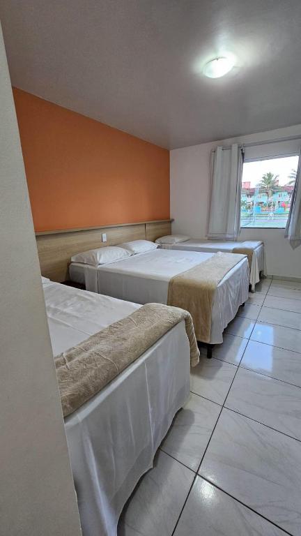 Postel nebo postele na pokoji v ubytování JL Temporadas - Quarto Portobello Park Hotel