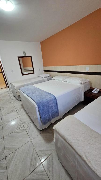 Postel nebo postele na pokoji v ubytování JL Temporadas - Quarto Portobello Park Hotel