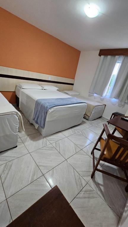 Postel nebo postele na pokoji v ubytování JL Temporadas - Quarto Portobello Park Hotel