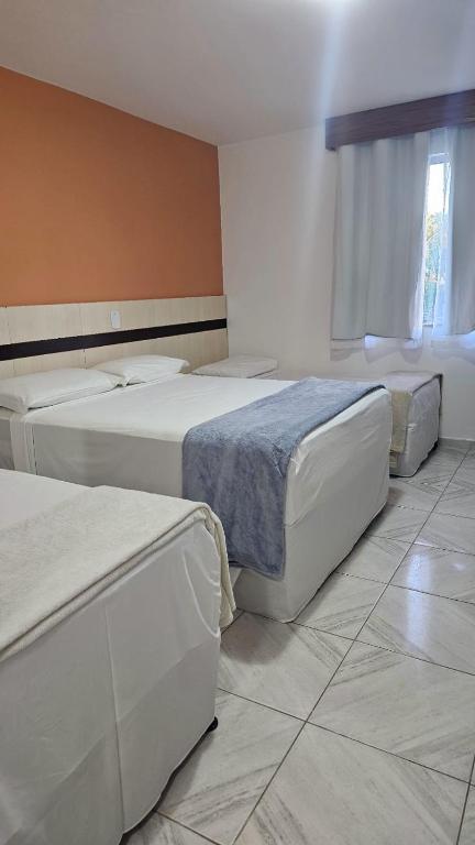 Postel nebo postele na pokoji v ubytování JL Temporadas - Quarto Portobello Park Hotel