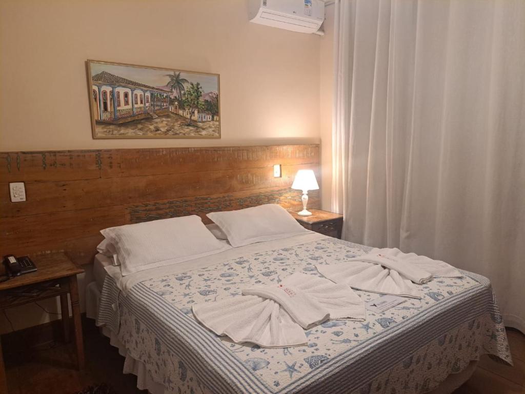 Postel nebo postele na pokoji v ubytování Pousada Encanto da Serra