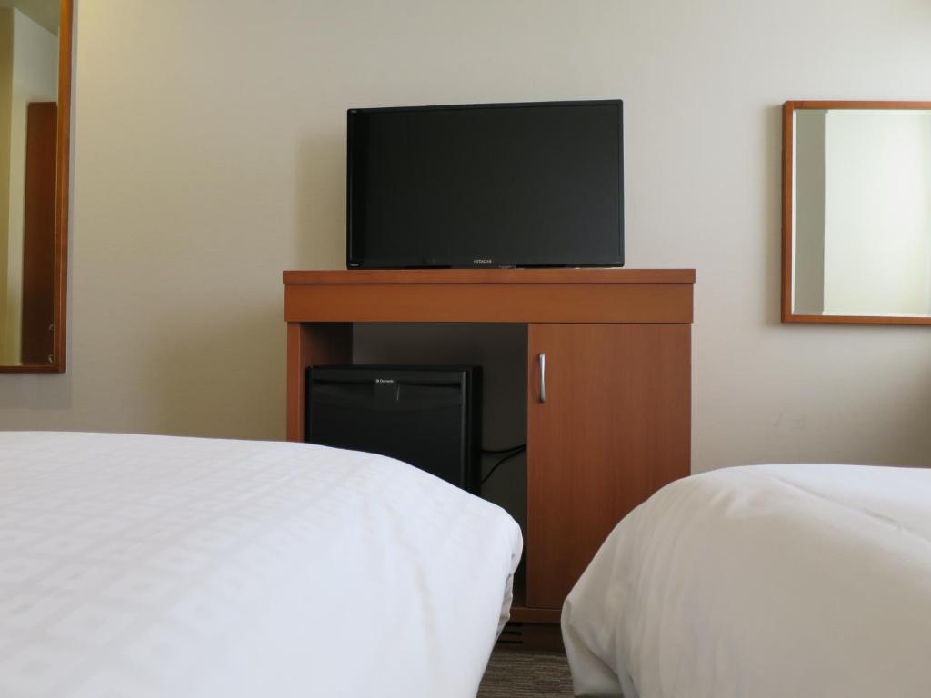 TV a/nebo společenská místnost v ubytování Sun Palace Hotel