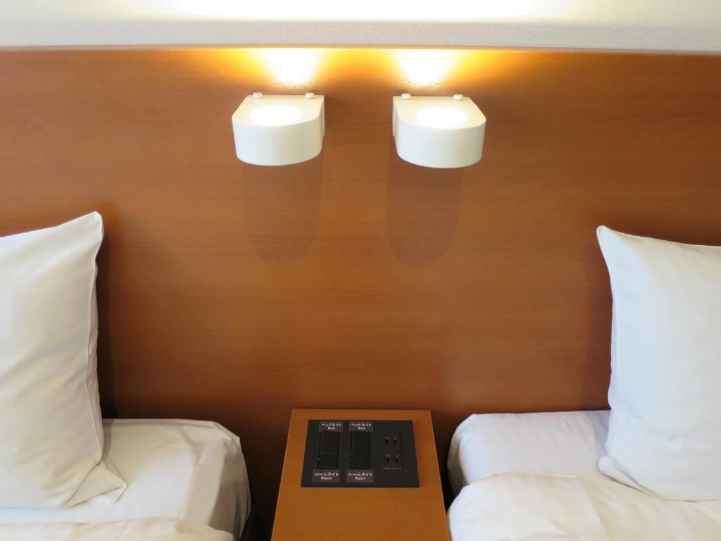 Postel nebo postele na pokoji v ubytování Sun Palace Hotel