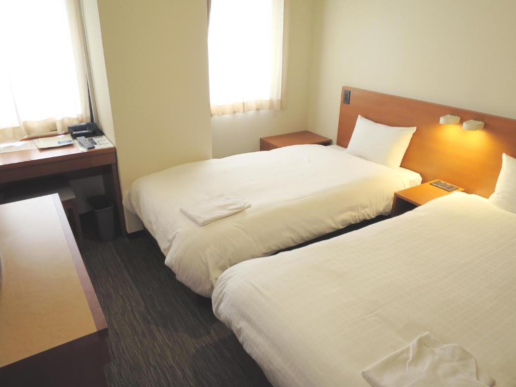 Postel nebo postele na pokoji v ubytování Sun Palace Hotel