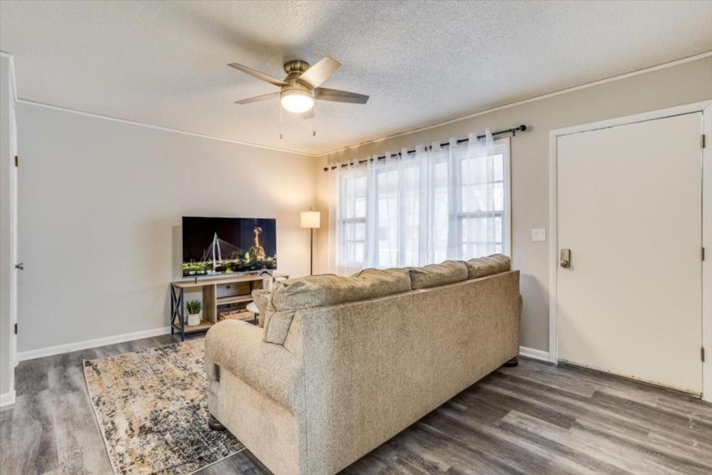 a living room with a couch and a ceiling fan at Andover Bungalow - Sleeps 6 in Andover