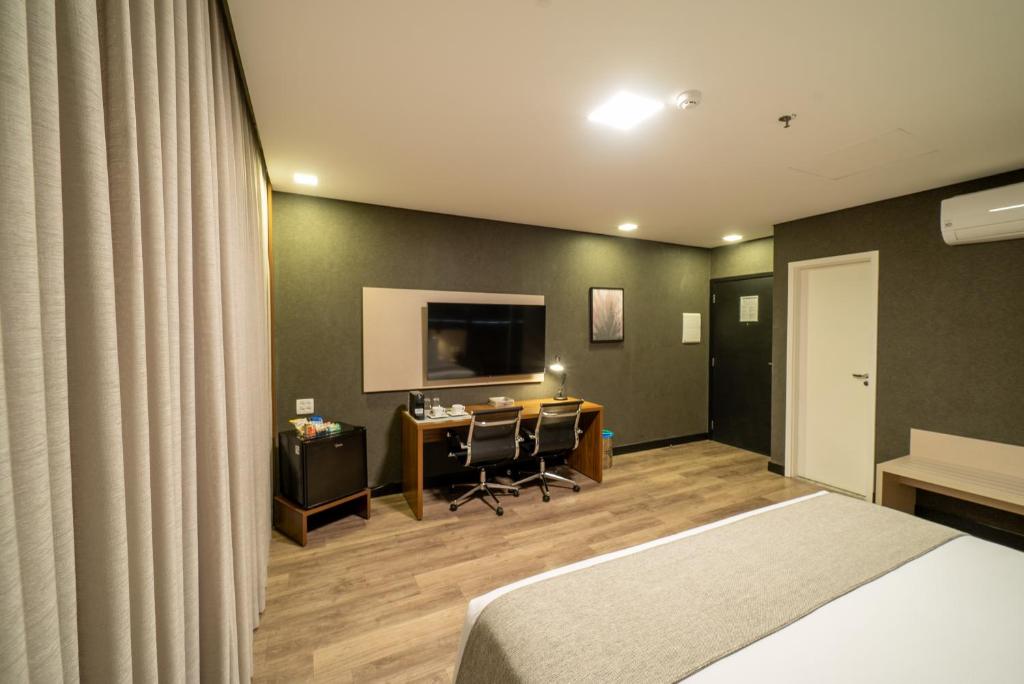 Postel nebo postele na pokoji v ubytování URBAN by UNU Osasco Hotel