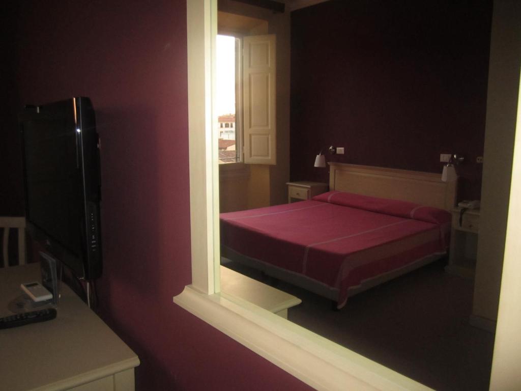 Postel nebo postele na pokoji v ubytování Hotel Genzianella