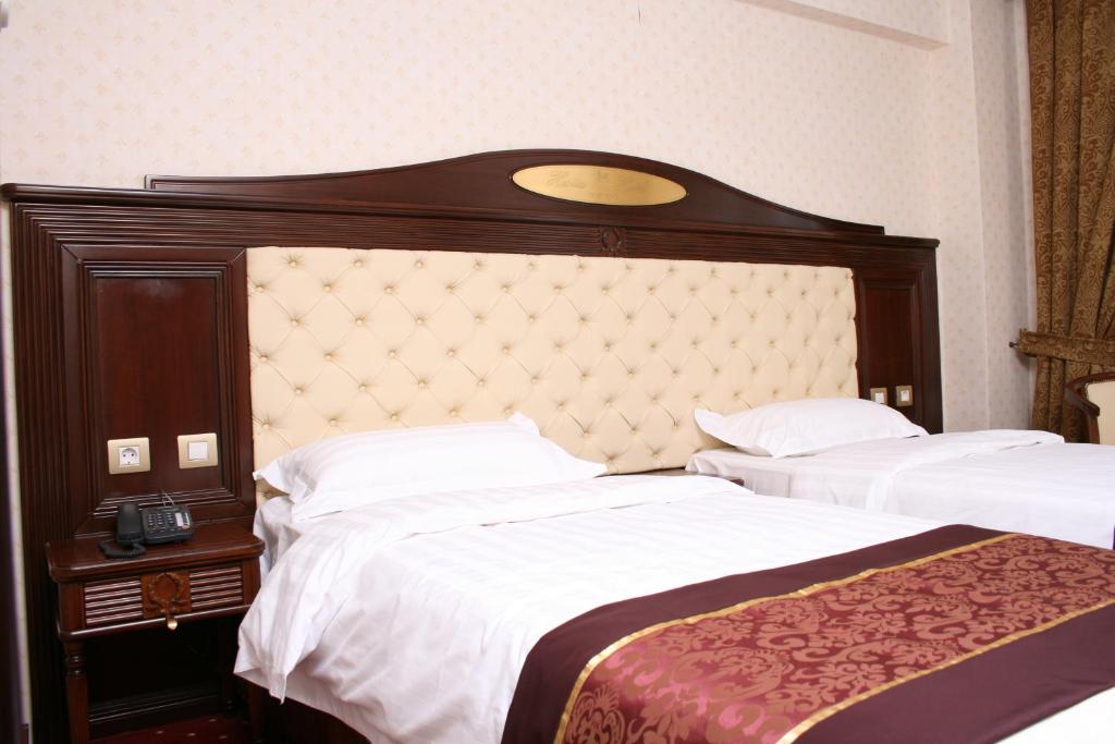 Postel nebo postele na pokoji v ubytování Hestia Hotel