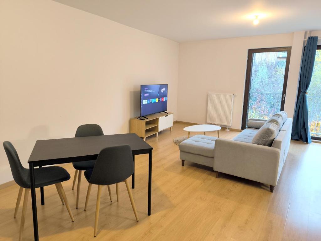 TV a/nebo společenská místnost v ubytování Appartement entier 56 m2 aux portes de Genève